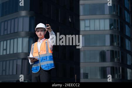Engineers inspect the completed air conditioning and water systems to continue verifying their functionality. Stock Photo
