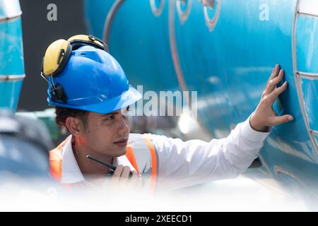 Engineers inspect the completed air conditioning and water systems to continue verifying their functionality. Stock Photo