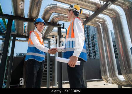 Engineers and technicians Inspect the completed air conditioning and water systems to continue verifying their functionality. Stock Photo