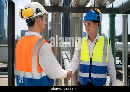 Engineers and technicians Inspect the completed air conditioning and water systems to continue verifying their functionality. Stock Photo