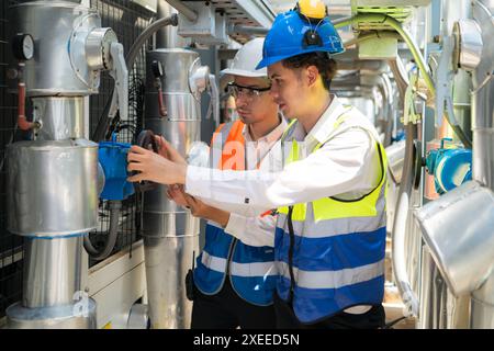 Engineers and technicians Inspect the completed air conditioning and water systems to continue verifying their functionality. Stock Photo