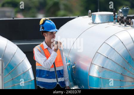 Engineers inspect the completed air conditioning and water systems to continue verifying their functionality. Stock Photo