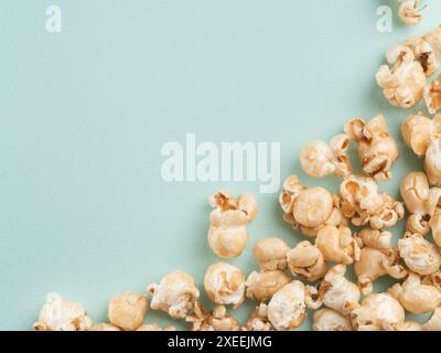 Popcorn on blue background with copy space Stock Photo