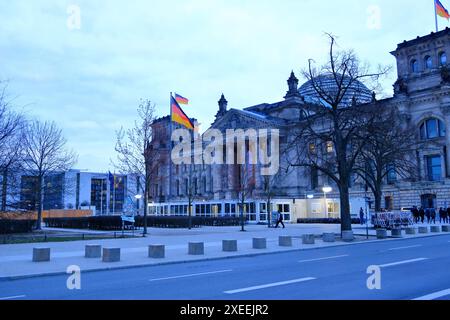 Berlin in Germany - March 13 2024: Reichstag building during the construction of the visitors center on a cloudy day Stock Photo