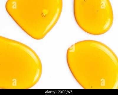 Honey drops abstract pattern, isolated on white Stock Photo