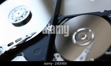 Hard drive from computer or laptop lies on the table in the repair shop. Performs fault diagnostics and performs urgent repairs recovery of lost data Stock Photo