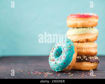 Stack of assorted donuts, copy space Stock Photo