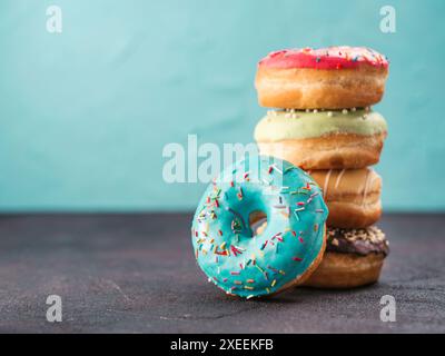 Stack of assorted donuts, copy space Stock Photo