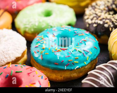 Close up of a delicious assorted donuts of different glazed in a soft ...
