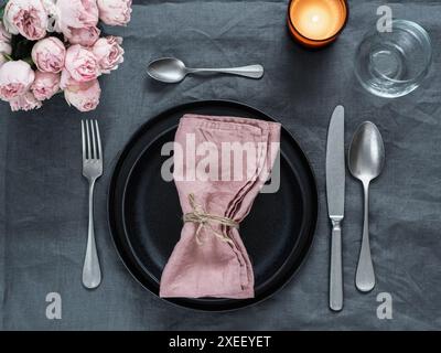 Beautiful table setting on gray linen tablecloth Stock Photo