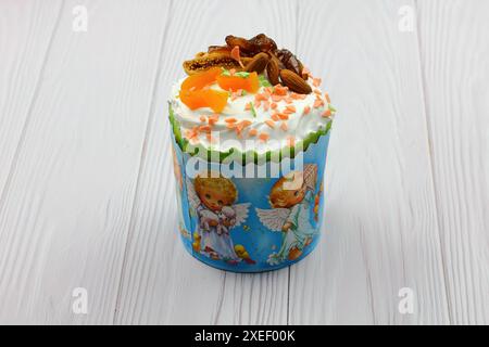 Traditional Russian Ukrainian Easter Cake Kulich. Orthodox Christian Easter Bread or Easter Cake with frosting, Easter Eggs Stock Photo