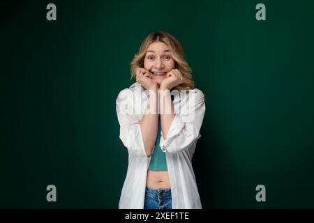 Woman Posing in Front of Green Background Stock Photo