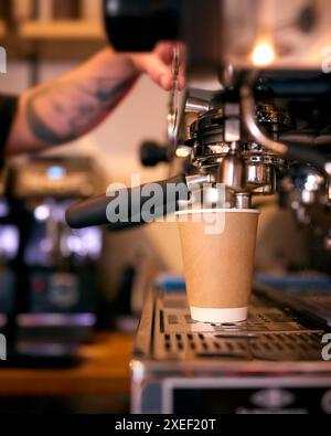 Close Up Of Barista At Machine Making Takeaway Coffee In Cafe Or Coffee Shop Stock Photo
