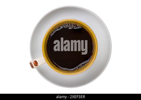 Top view of black coffee in brown ceramic coffee cup in white ceramic saucer. Stock Photo