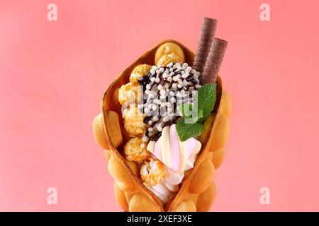 Hong kong or bubble waffle with ice cream, chocolate sauce and isolated on white background. Stock Photo