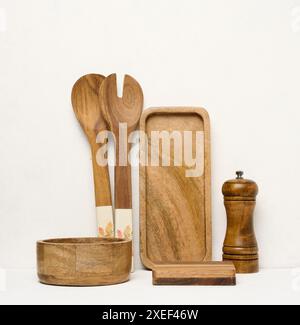 Various wooden kitchen utensils on a white background Stock Photo