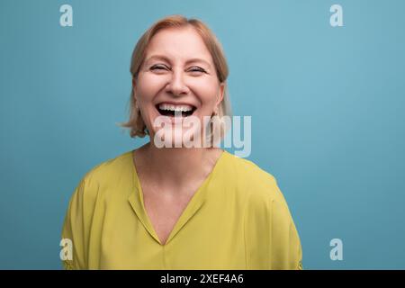 Horizontal closeup of happy middle aged woman in casual outfit Stock Photo