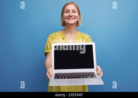 Business mature woman with laptop for remote work Stock Photo