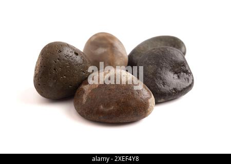 Set of Five River Stones Isolated on a White Background Similar to the Story of David and Goliath Stock Photo
