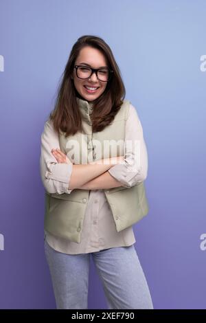 Portrait of a pretty young brunette woman in a casual look and glasses Stock Photo