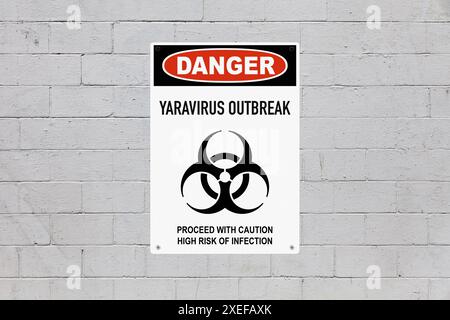 Warning sign screwed to a brick wall to warn about a health hazard. In the middle of the panel, there is a biohazard symbol and the message is saying Stock Photo