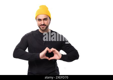 Young handsome caucasian brunette man with beard in informal style on white background with copy space Stock Photo