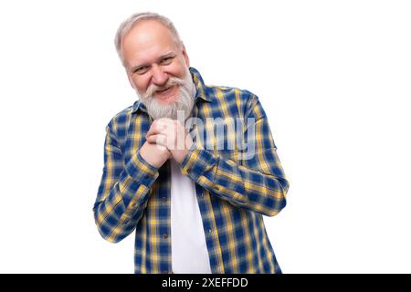 Charming well-groomed senior pensioner gray-haired man with a beard in a shirt Stock Photo