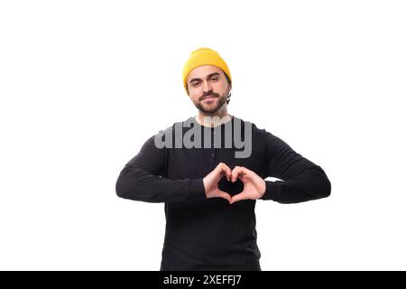 Young friendly caucasian brunette man with beard in casual sweatshirt Stock Photo