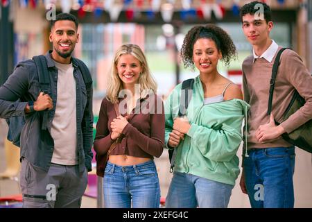Portrait Of Group Of University Students With Bags In College Building Stock Photo