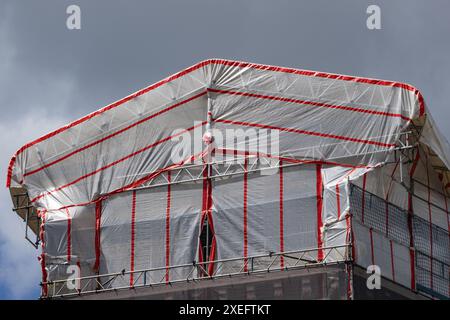 Scaffolding with roof cladding on old building Stock Photo