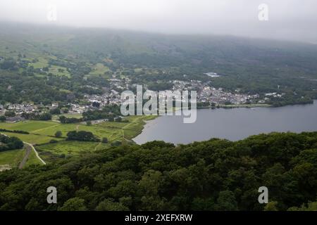 View of Llanberis town and Llyn Padarn on an overcast day in Snowdonia in North Wales from the Dinorwig slate quarry elevated viewpoint Stock Photo