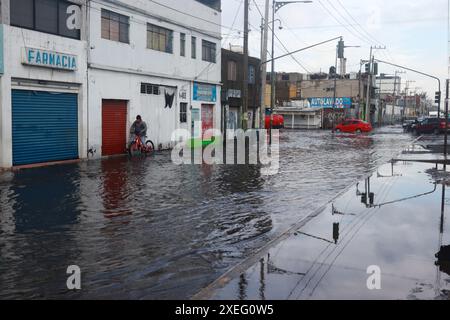 Mexico City, Mexico. 27th June, 2024. A flooded street is seen in the ...