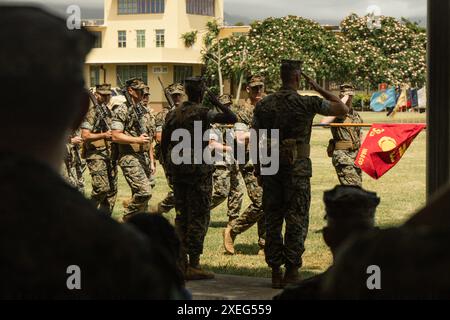 U.S. Marine Corps Lt. Col. Osman Sesay, (left) outgoing commanding officer, 3d Littoral Logistics Battalion, 3d Marine Littoral Regiment, 3d Marine Division, and Lt. Col. Todd Hoyt, (right) incoming commanding officer, render salutes during the pass in review portion of the battalion’s change of command ceremony at Marine Corps Base Hawaii, June 24, 2024. The ceremony signifies the transfer of command from Lt. Col. Osman Sesay to Lt. Col. Todd Hoyt. (U.S. Marine Corps photo by Sgt. Grace Gerlach) Stock Photo