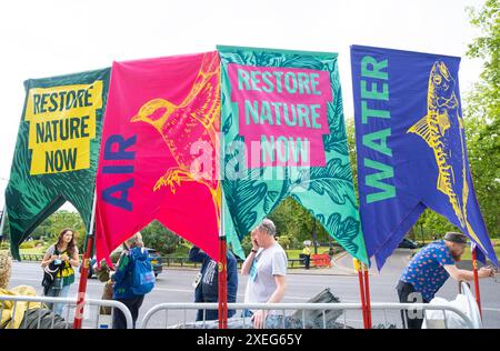 London, UK. 22nd June 2024. Banners in a row at the Restore Nature Now protest demonstration in London, calling for urgent political action on the nature and climate emergencies. Stock Photo