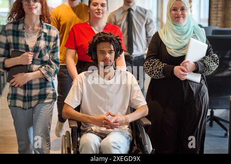 A diverse group of young business people congregates within a modern startup's glass-enclosed office, featuring inclusivity with Stock Photo