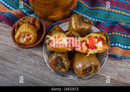 Stuffed pickles made from bell peppers. Stuffed pickles contain sliced carrots, cabbage and red pepper. Pickles are an indispensable appetizer of tr Stock Photo