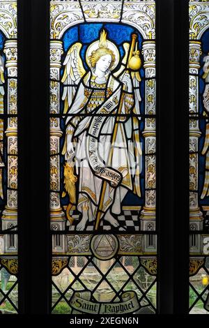 Archangel Raphael in the stained glass East window designed by Eric ...