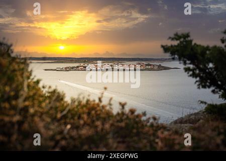 Landscape shot with a view of an island. Astol, RÃ¶nnÃ¤ng, Sweden, with typical Swedish houses Stock Photo