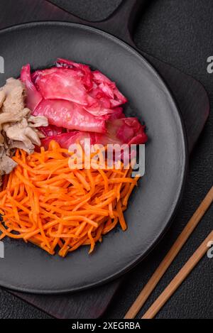 Delicious spicy mushrooms, carrots, cabbage sliced and cooked in Korean style Stock Photo