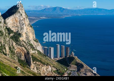 Airplane lands at Gibraltar airport with a view of the Rock and new skyscrapers being built Stock Photo