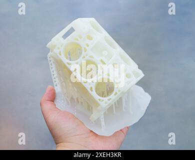 Detailed models in form of internal combustion engine printed on 3D printer from polymer close-up. Detailed object created by 3D printer using 3D printing method. Concept 3D Printing. SLA technology Stock Photo