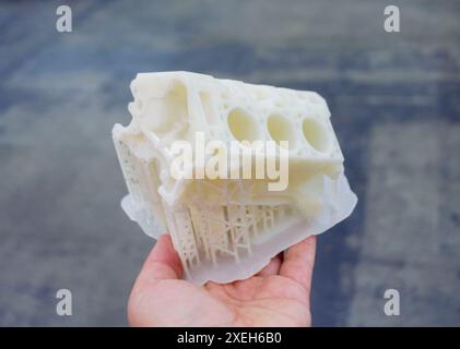 Detailed models in form of internal combustion engine printed on 3D printer from polymer close-up. Detailed object created by 3D printer using 3D printing method. Concept 3D Printing. SLA technology Stock Photo