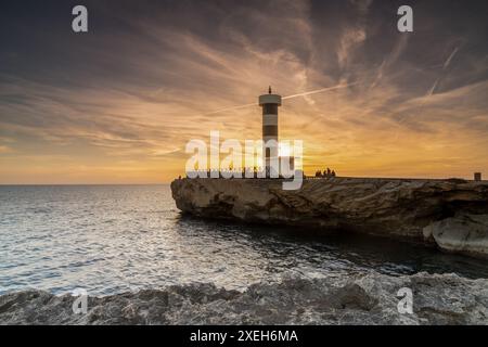 View of the lighthouse at Colonia Sant Jordi in Mallorca at sunset Stock Photo