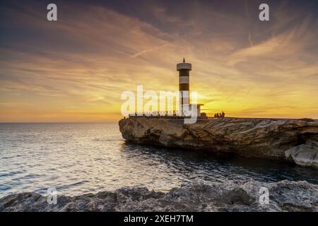 View of the lighthouse at Colonia Sant Jordi in Mallorca at sunset Stock Photo