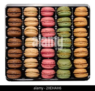 Multi-colored macarons in a plastic box, top view. Assortment Stock Photo