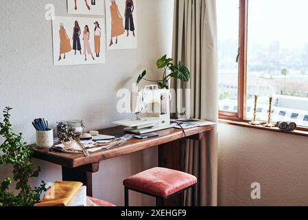 Workshop, fashion design and sewing machine for fabric, creative and empty in boutique, tools and material. Shop, equipment and organized for Stock Photo