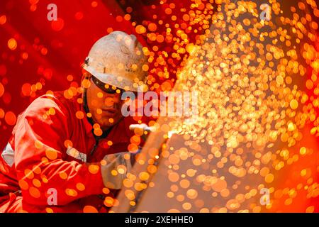 Beijing, China's Jiangsu Province. 26th June, 2024. A worker works at the construction site of central platform of the first phrase of Bozhong 26-6 oilfield development project in Qingdao, east China's Jiangsu Province, June 26, 2024. Credit: Du Penghui/Xinhua/Alamy Live News Stock Photo