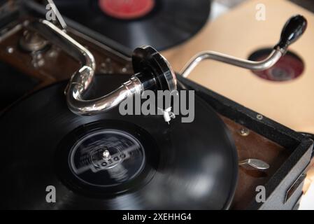 Old vintage turntable vinyl record player with disc spinning and playing music Stock Photo