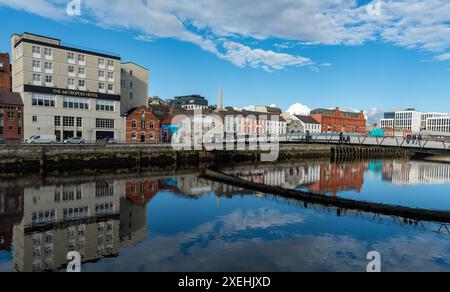 Colorful buildings reflected on river lee. Cork city Ireland Stock Photo