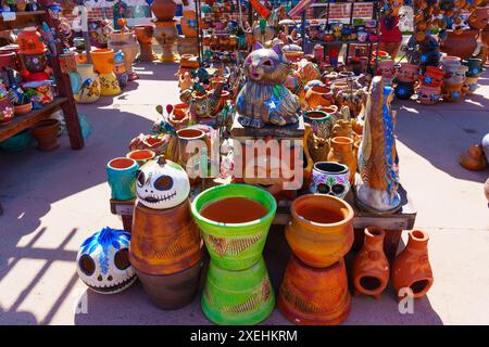 San Diego, California - April 16, 2024: Colorful ceramic sculptures, pots, and decorations in a bustling outdoor market. Stock Photo